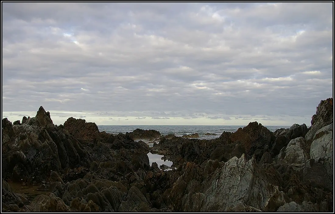 Jagged rocks march out into Bass Strait, Naracoopa, King Island, 2009. Peter Neaum. - panoramio