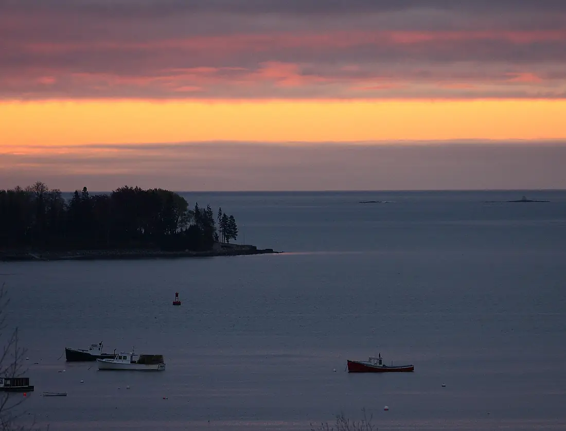 A dark sunrise over Mount Desert Island, Maine