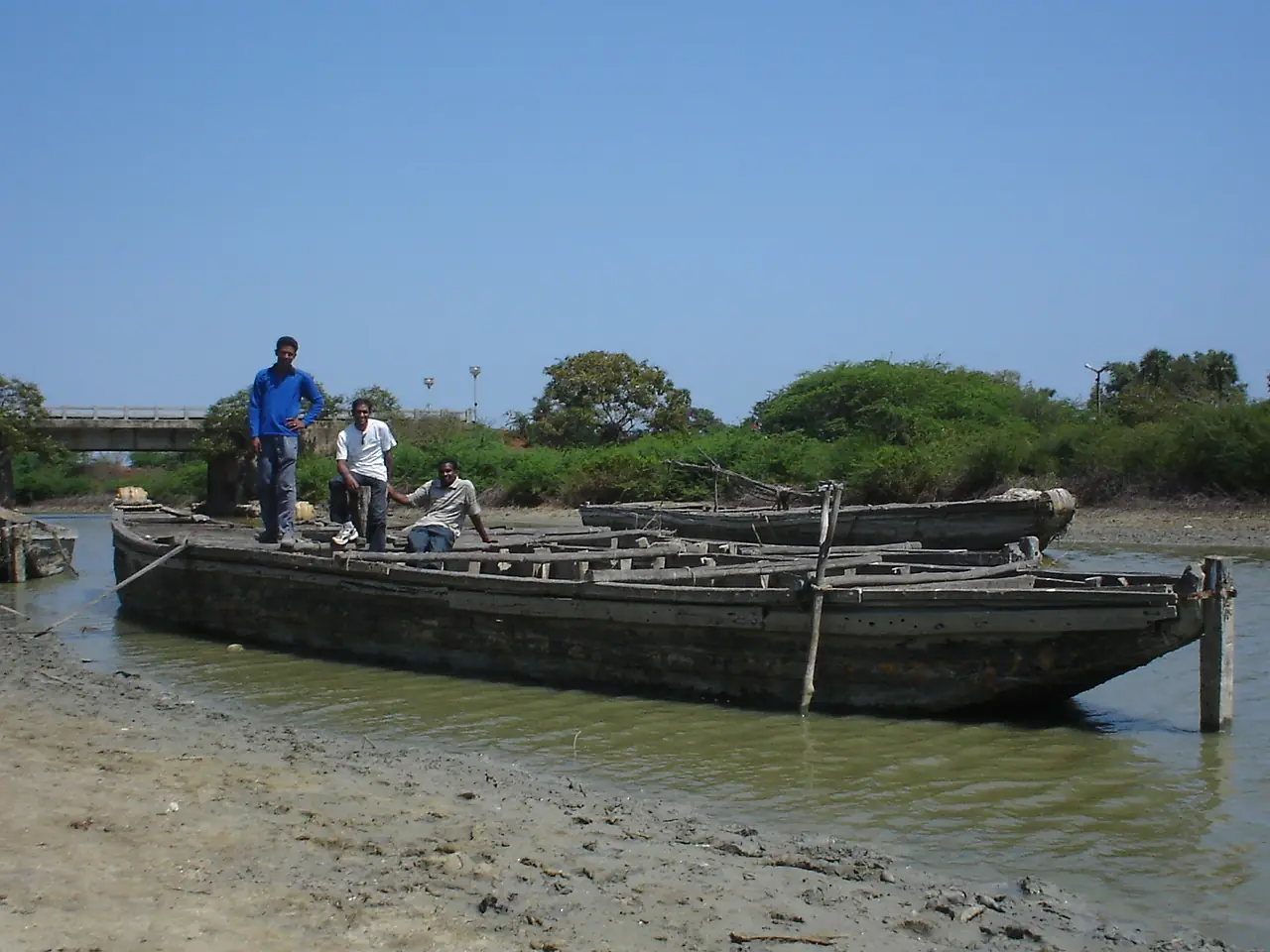 Three men on a boat (Sriharikota, Andhra Pradesh, India) 2006