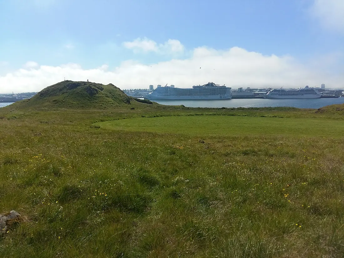 Hill on the Viðey island with Reykjavík harbour